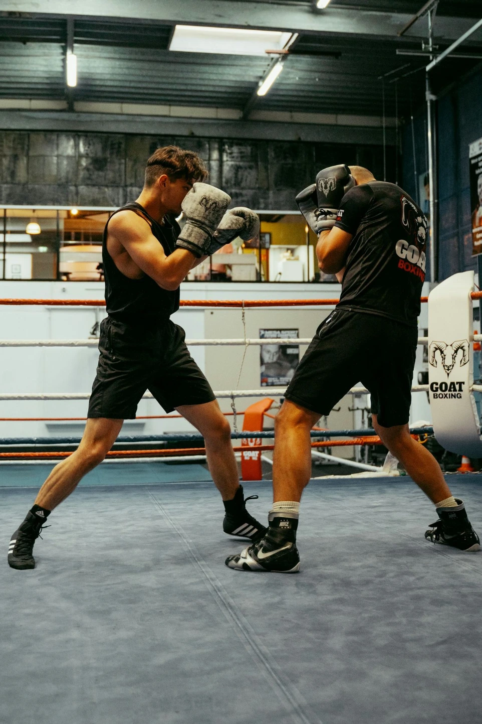 A couple of men standing in a boxing ring
